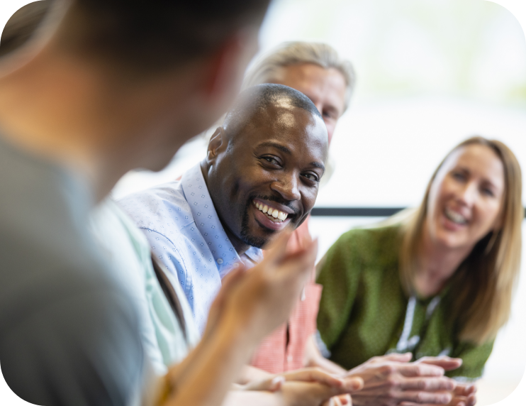 Man smiling in conference